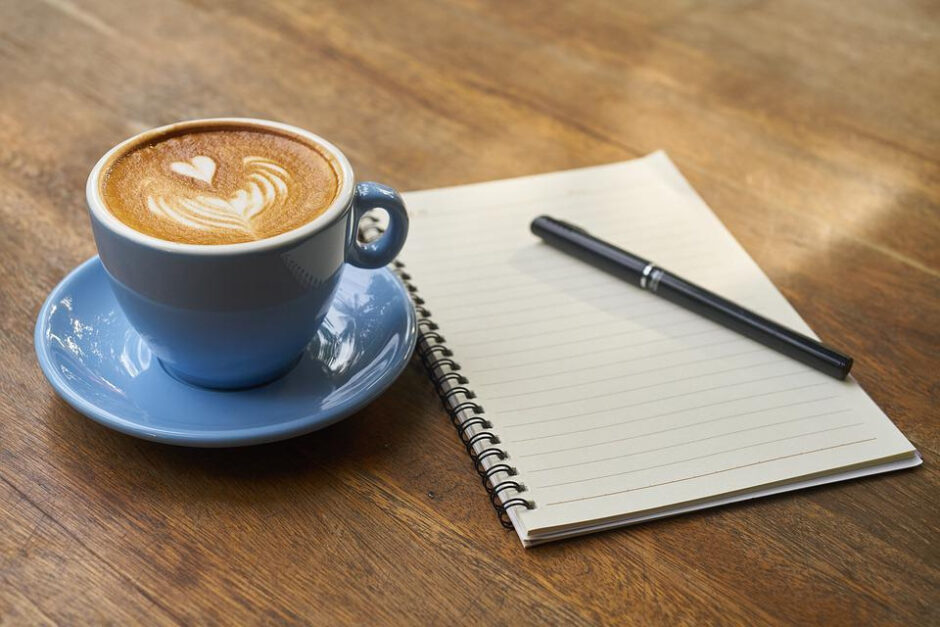 a notebook and coffee